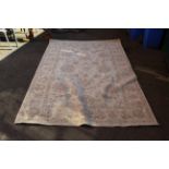 A Chinese cream wool rug,