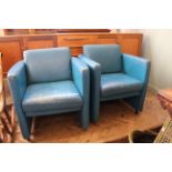 A pair of vintage blue leather tub chairs,