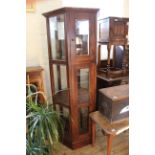 A hexagonal glazed display case with two doors