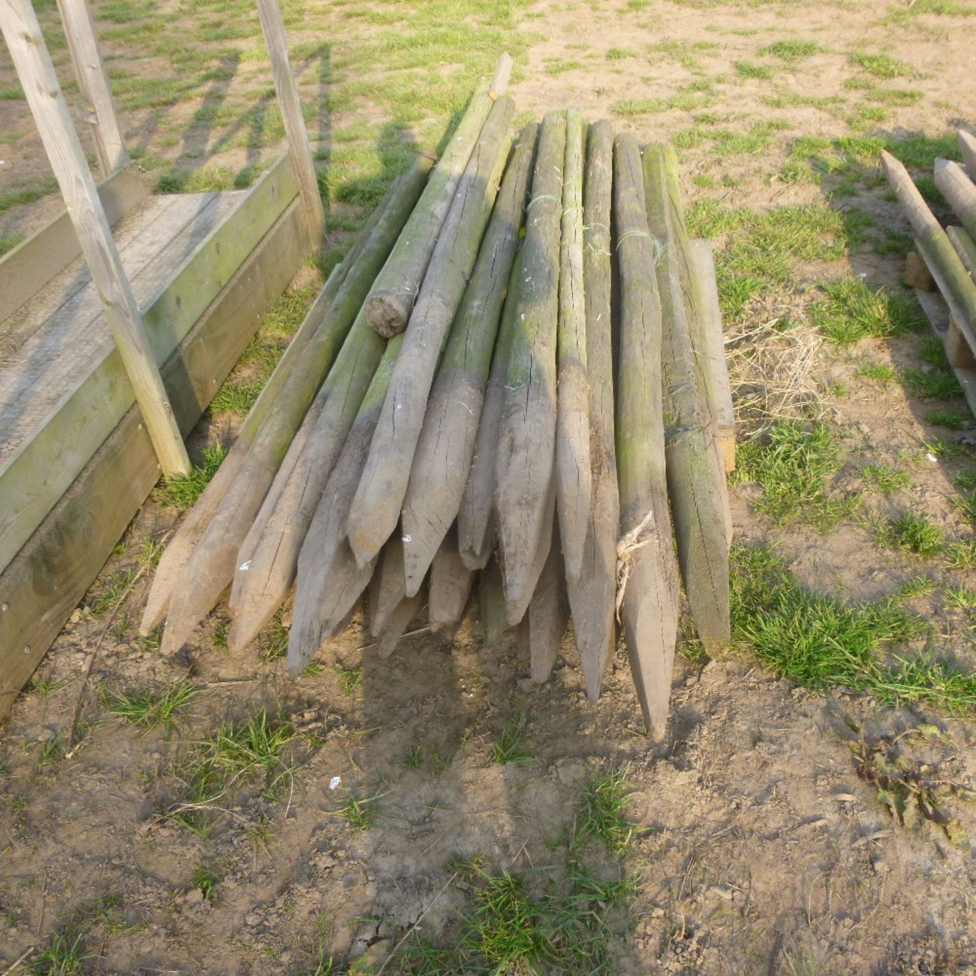 Pallet of round fencing posts