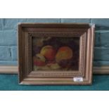 A late 19th Century framed oil on canvas of a still life of fruit on a table, signed 'J Piggott',