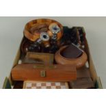 A box of mixed wood wares including a footed bowl, pipe rack with pipes, small wooden boxes,