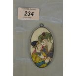 A 19th Century Persian miniature oval painting on ivory of two lovers in a silver mount,