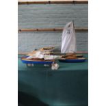 Two 'Uffa Fox' vintage wooden catamaran's plus a 'Star Yachts' pond yacht,