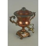 A Regency copper samovar of smallish proportions with twin scrolled handles and brass top,