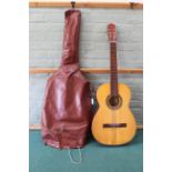 A vintage Audex Spanish guitar in bag (crack to back and wear)