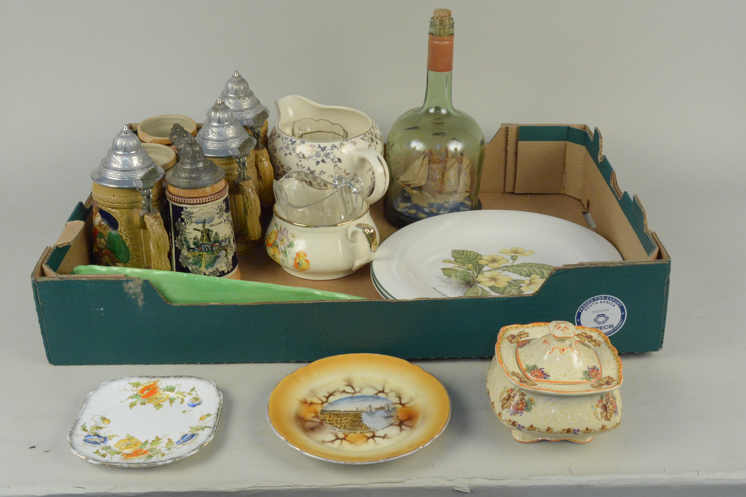 A mixed lot comprising various lidded steins and mugs,