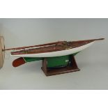 A large wooden pond yacht on stand,