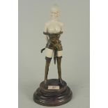 A composition and metal mounted semi nude female figure in the Art Deco style