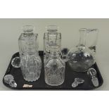 A pair of square cut glass whisky decanters,