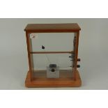 A mid 20th Century teak cased scientific instrument/gauge
