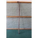 An antique (possibly African) ethnic carved wooden spear handle (well used with splits to wood,