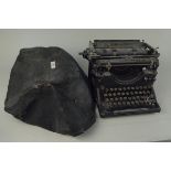A vintage Underwood typewriter with cover