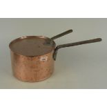 A 19th Century seamed copper saucepan and lid, each with iron handle,