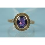 A 9ct gold single amethyst set ring with flared border, size R, weight approx 3.
