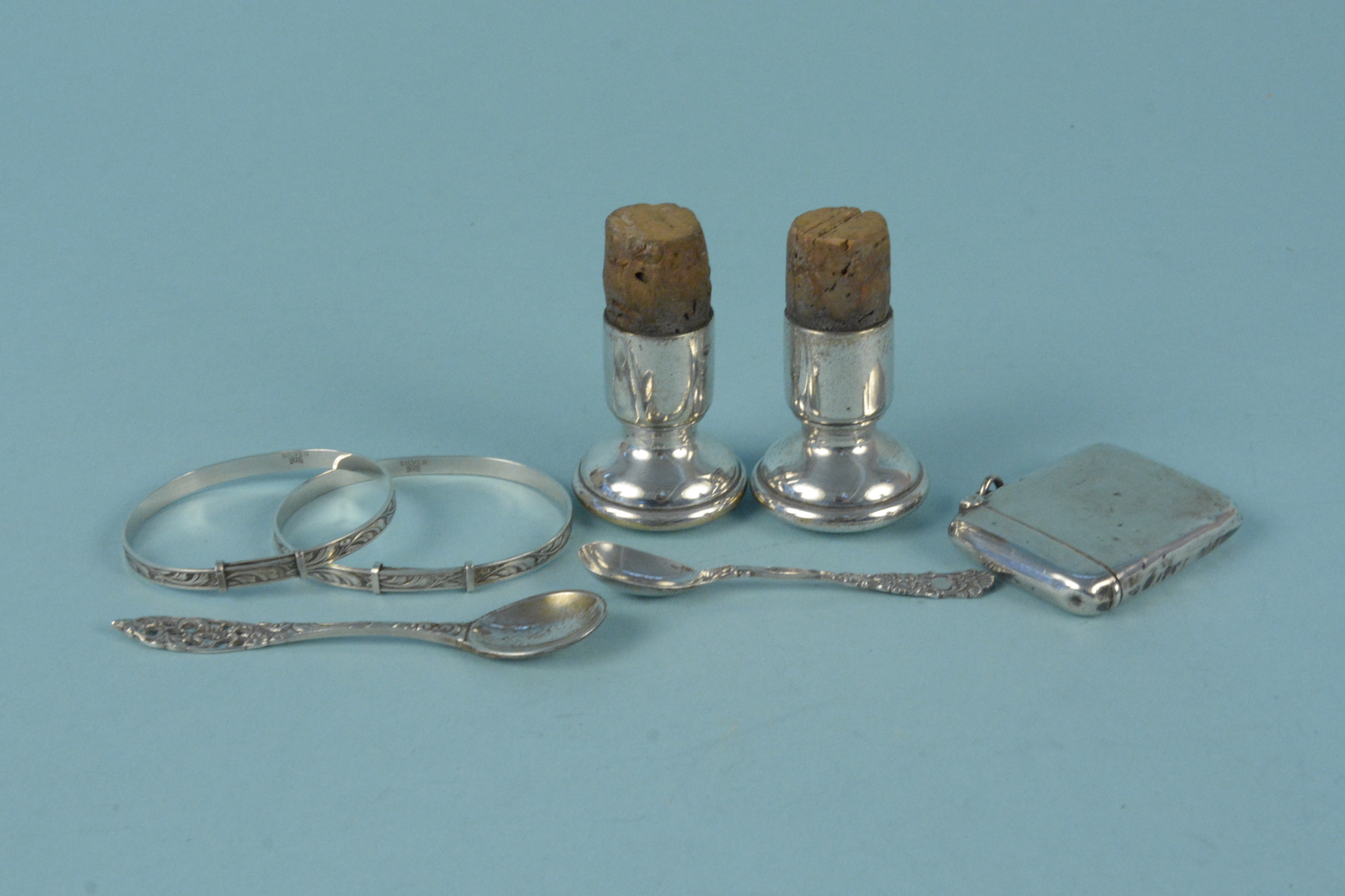 Two WMF bottle stoppers, two childs silver bangles,