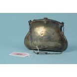An antique silver evening purse with engine turned decoration,