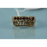 A 9ct gold ring depicting the word 'Mother' with a row of claw set garnets above, size S,