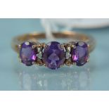 A 9ct rose gold amethyst and diamond set ring,