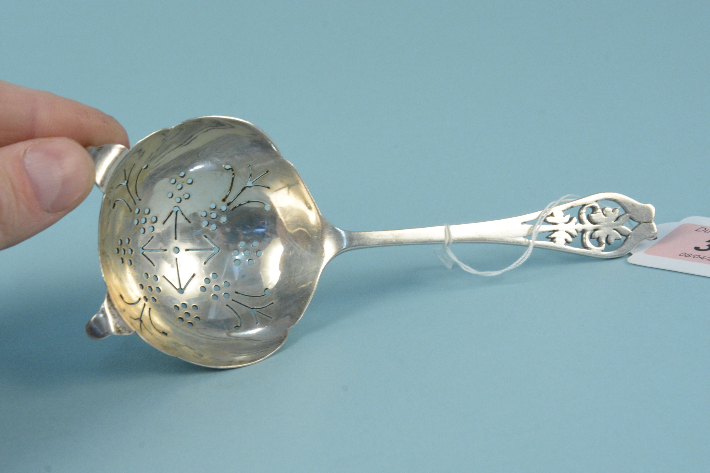 A silver tea strainer with pierced decoration to handle, - Image 2 of 3