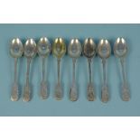 A set of eight silver teaspoons all florally engraved,