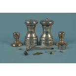 A silver pepper mill (as found), a silver salt of mill form and two miniature silver candlesticks