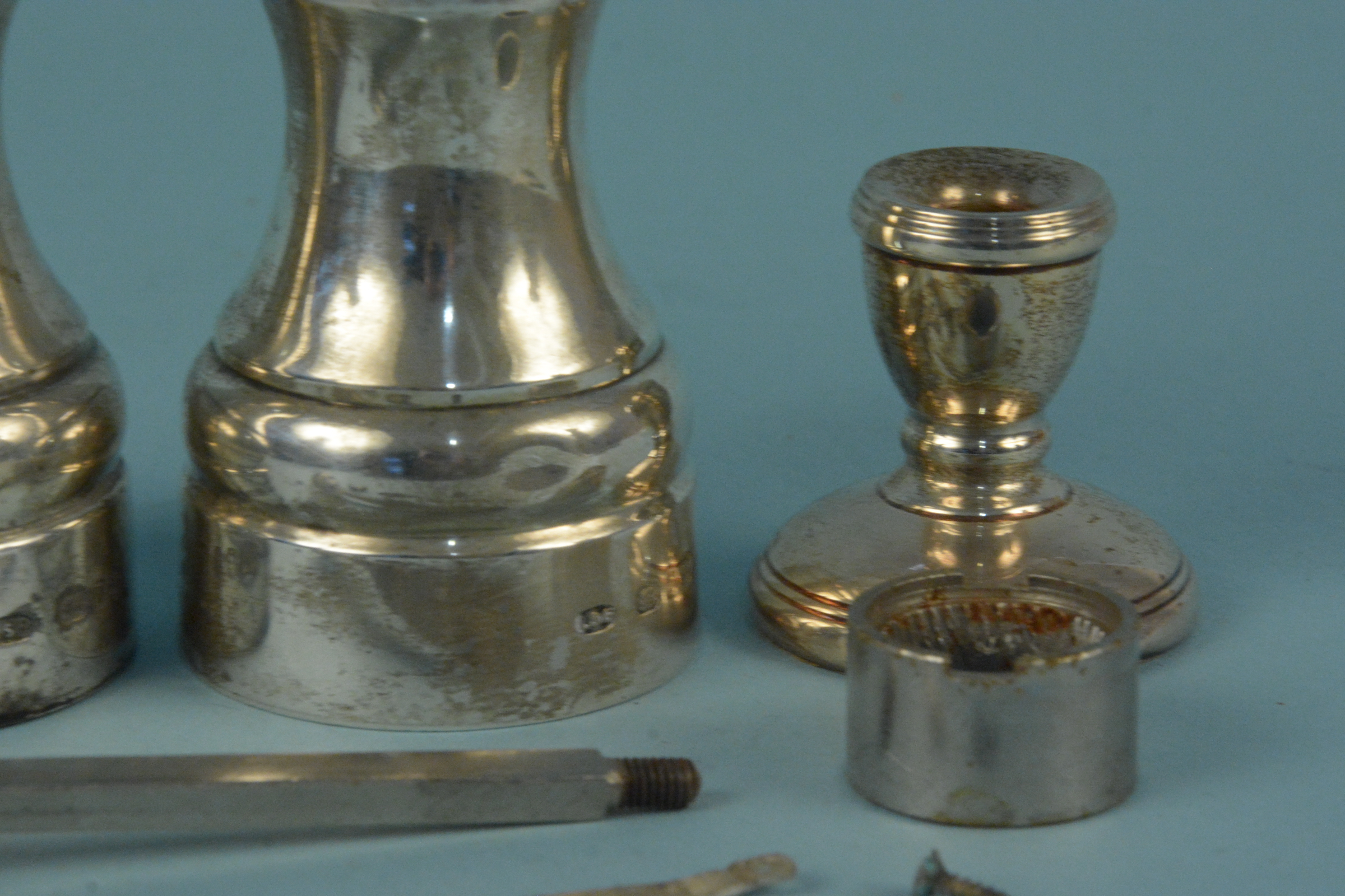 A silver pepper mill (as found), a silver salt of mill form and two miniature silver candlesticks - Image 3 of 3