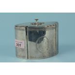 A Georgian silver tea caddy with engraved border and large monogram to centre with applied floral