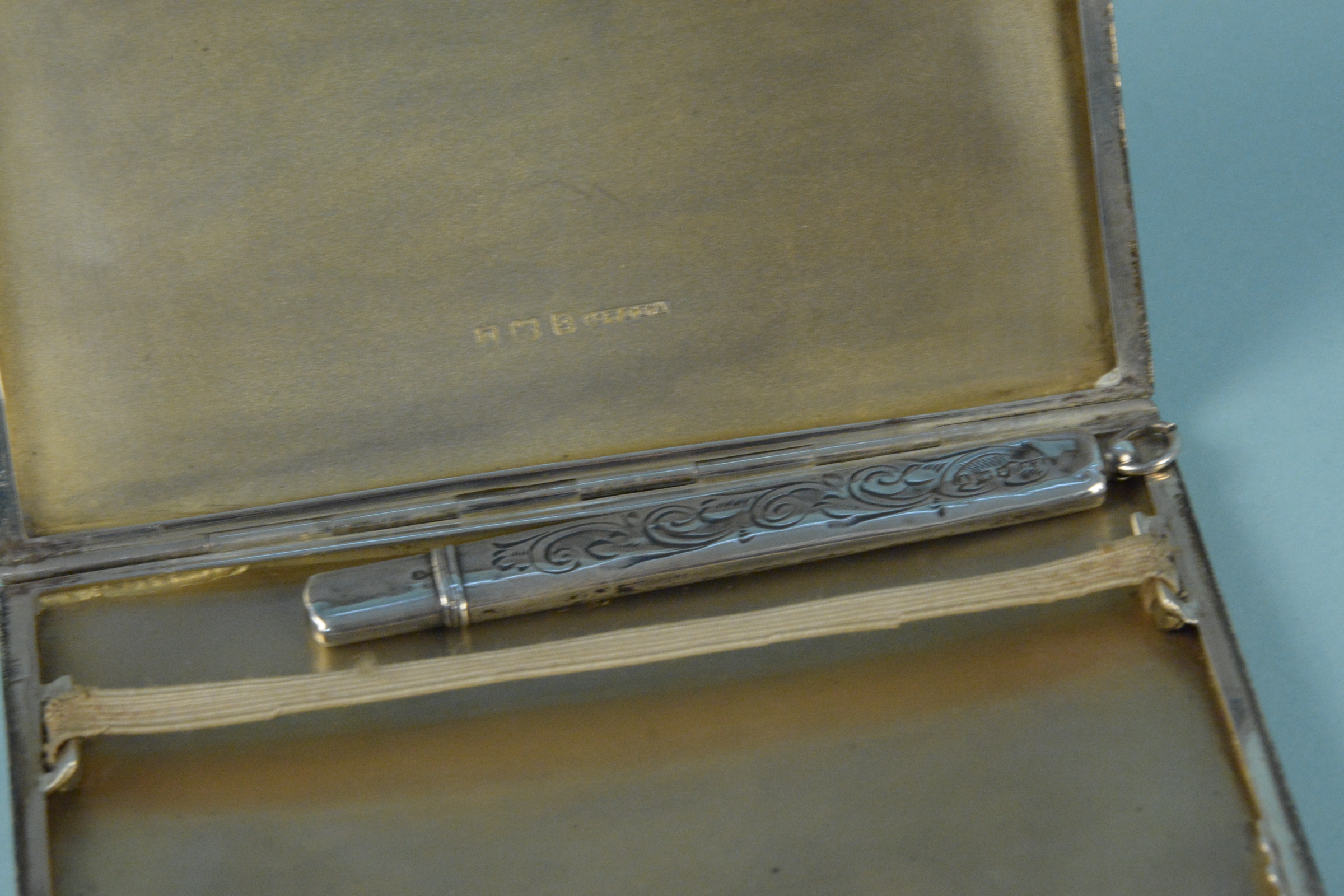 A silver cigarette case with engine turned detail and engraved monogram, - Image 3 of 3