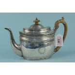 A Georgian silver teapot with engraved floral decoration, wood handle and finial,
