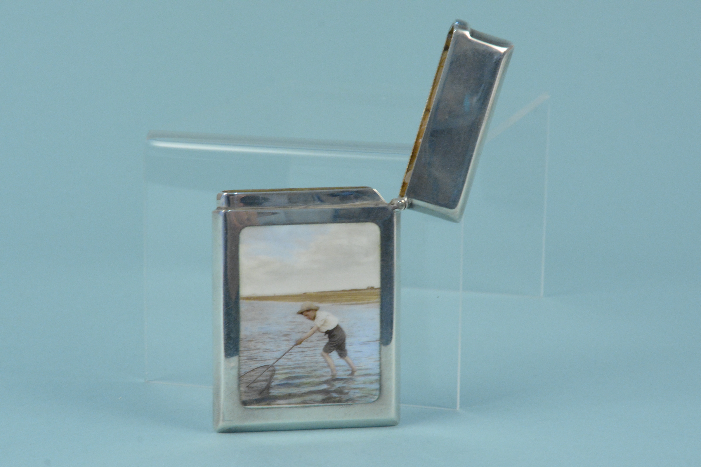 A silver card case with enamelled beach scene to both sides, one side with a lady paddling in water, - Image 2 of 3