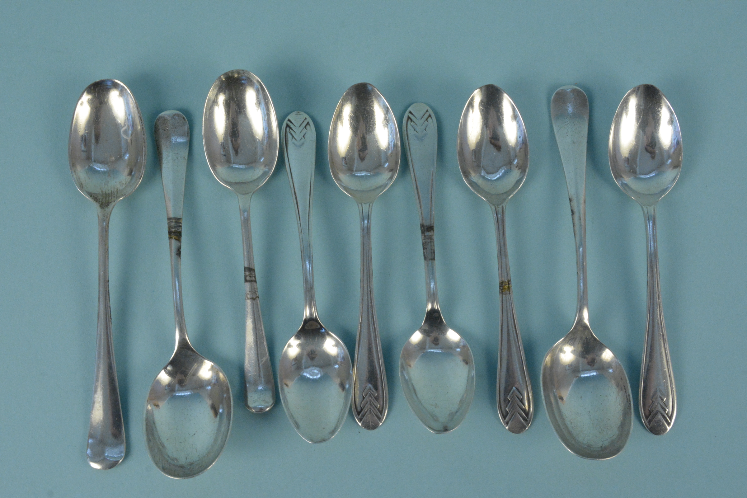 Nine various silver teaspoons,