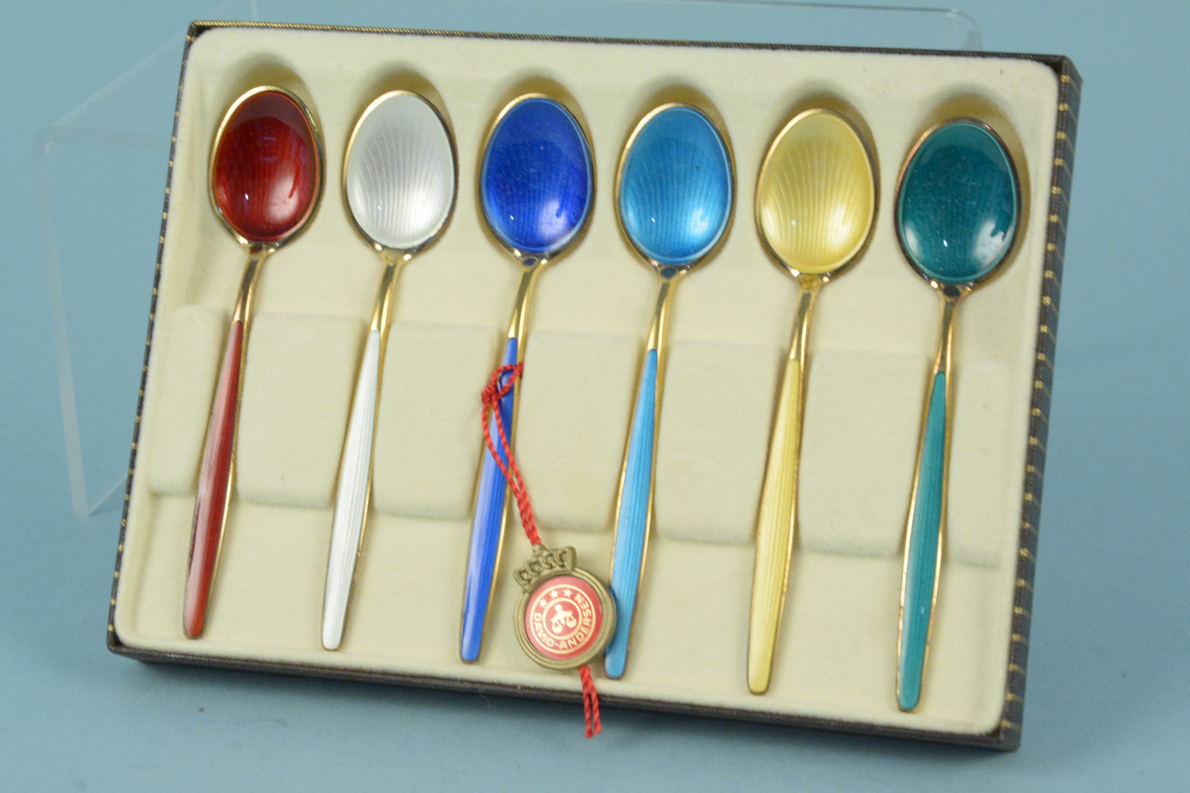 A set of David Anderson silver gilt enamelled coffee spoons in original box and original tag