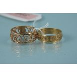 A 9ct gold band ring engraved Millennium together with a 9ct gold pierced heart design band ring,
