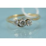 An 18ct platinum set three stone diamond ring, size P,