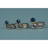 A graduating set of three silver enamelled ducks,