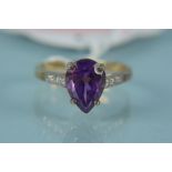 A 9ct gold amethyst and diamond set ring,