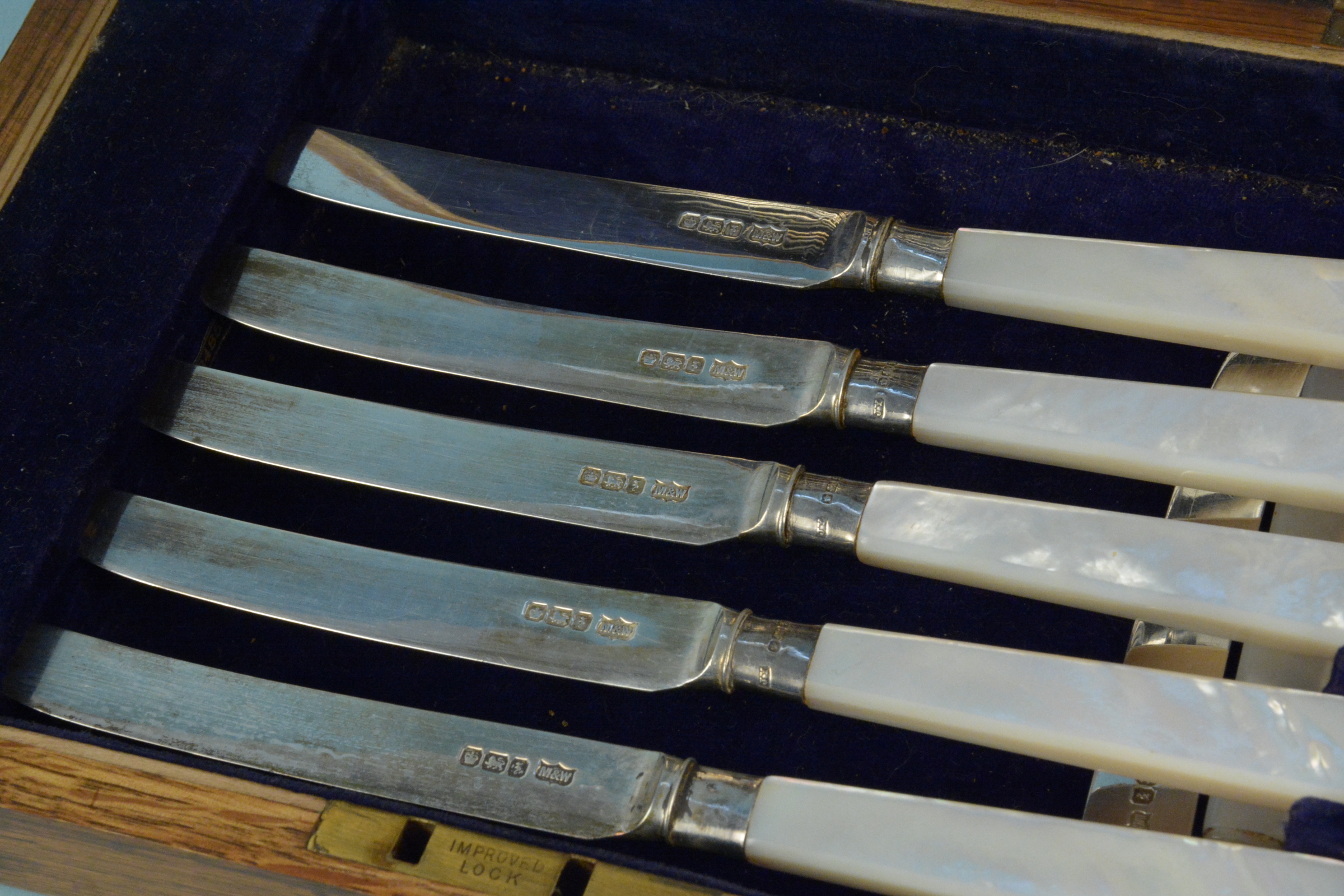 A cased set of six silver dessert knives and forks with mother of pearl handles (one knife is as - Image 2 of 3