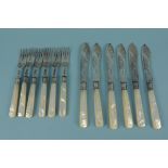 A set of six silver mother of pearl handled fish knives and forks,