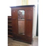 An Edwardian inlaid mahogany double wardrobe