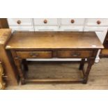 A 20th Century Jacobean style oak hall table with two drawers