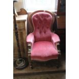 A late Victorian gent's armchair in velvet upholstery