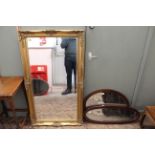 Two Edwardian inlaid mahogany oval wall mirrors together with a large 20th Century bevelled glass