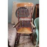 A mid 19th Century spindle back beech and elm rocking chair