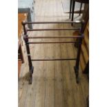 A Victorian towel rail and a Victorian style stripped pine towel rail