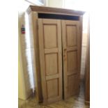 A late 19th Century pine two door cupboard with shelved interior, approx.