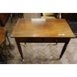A Victorian mahogany two drawer writing table with later top