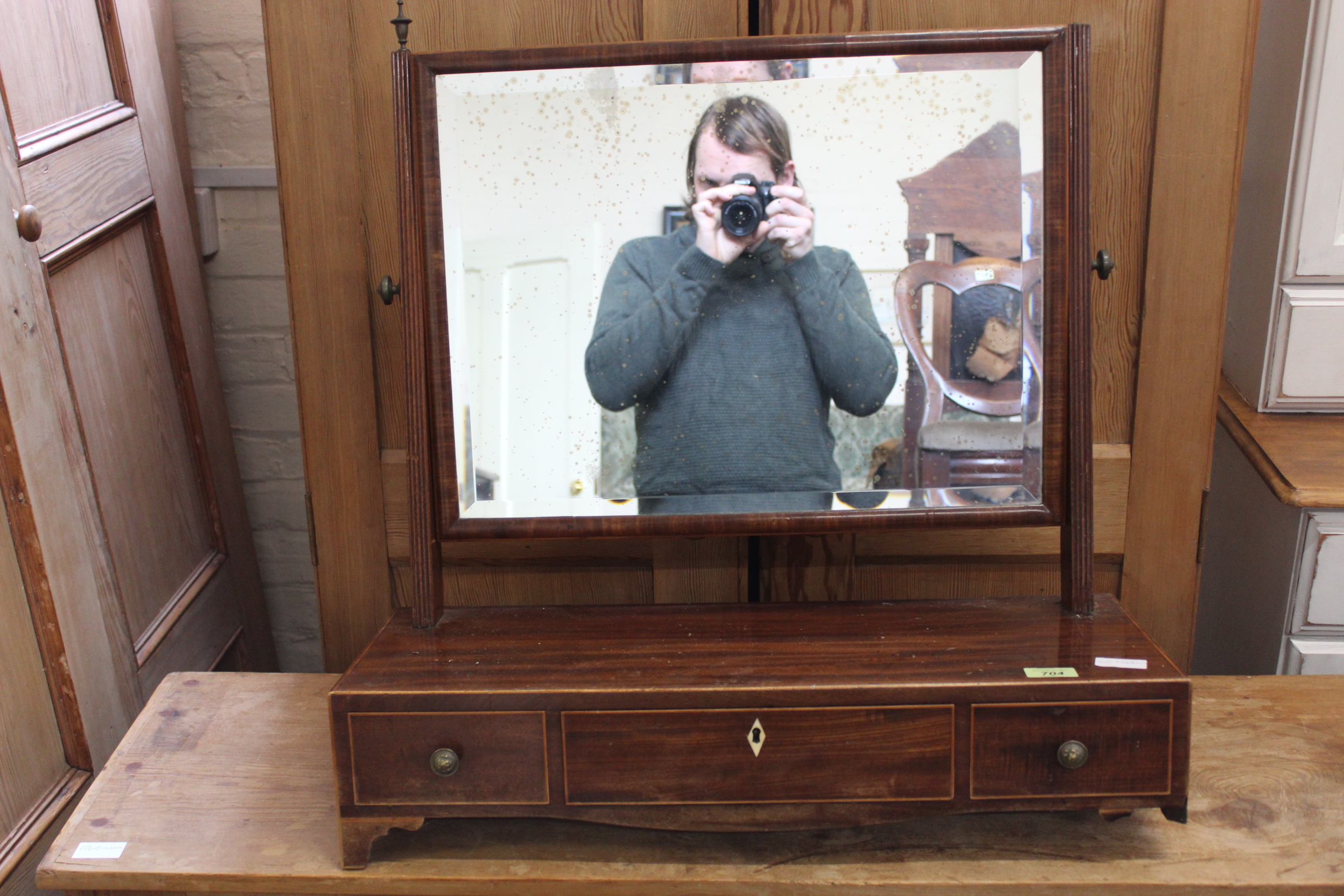 A Regency mahogany swing toilet mirror (feet as found)