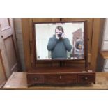 A Regency mahogany swing toilet mirror (feet as found)