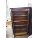 A 20th Century walnut open bookcase on bracket feet, approx.